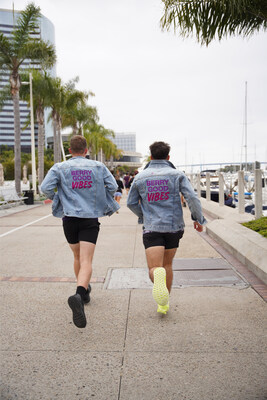 Runners in Seaport Village featuring Custom SAMBAZON Merch and Jean Jackets during the Taste the Alegria Pop up Event