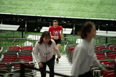 3x Team Canada Olympic athlete Jason Burnett running up the stands of BC Place stadium at last year's Climb for Nature. (CNW Group/World Wildlife Fund Canada)