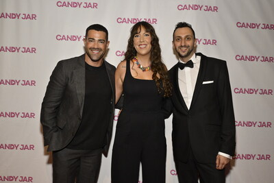 Jesse Metcalfe poses with Inkitt CEO Ali Albazaz and Inkitt CIO and Co-founder of Galatea Emma Tonner at the CandyJar red carpet premiere for “Keily: Homecoming Dweeb” at the Saban Theatre in Beverly Hills, CA.