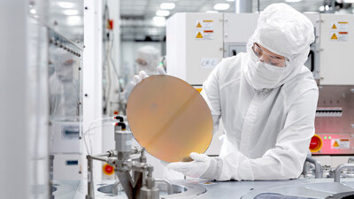An employee at one of Texas Instruments’ 300mm semiconductor fabs in Sherman, Texas, SM1.