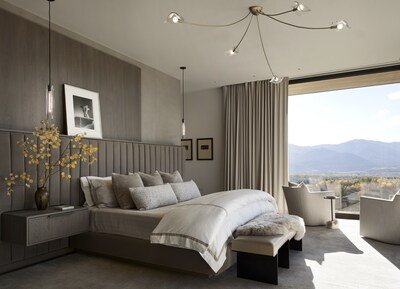 In the primary bedroom, a Horst P. Horst photo rests casually on a WRJ custom-designed headboard wall upholstered in velvet, enhancing the feel of peaceful sanctuary.