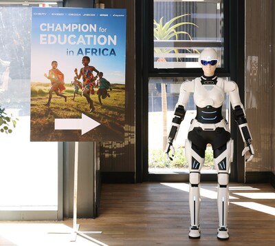 Mornine serves as event greeter at the “Champion for Education in Africa” venue. (PRNewsfoto/AiMOGA Robotics)