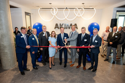 Akima executives and local Huntsville dignitaries take part in a ribbon-cutting ceremony celebrating the opening of the new facility.