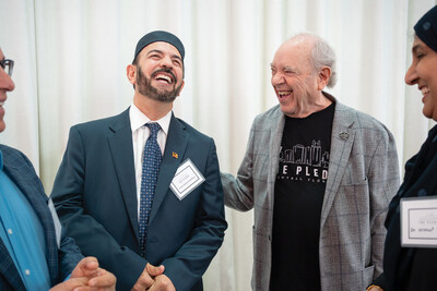 Philanthropist Alan Ginsburg and Imam Muhammad Musri sharing a moment of connection at last year's Central Florida Pledge Leadership Summit.