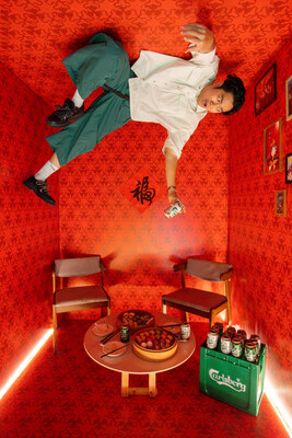 Guests enjoying the photo installation featuring an upside down room. Guests enjoying the photo installation featuring an upside down room.